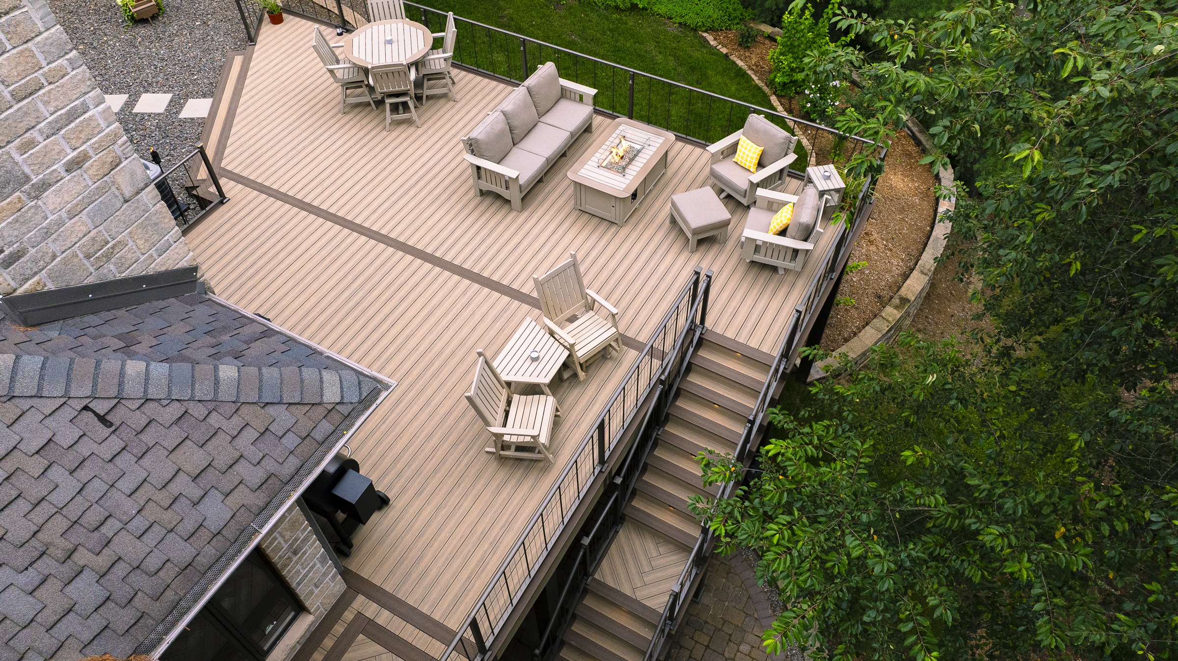 Elevated backyard deck with seating and fire pit