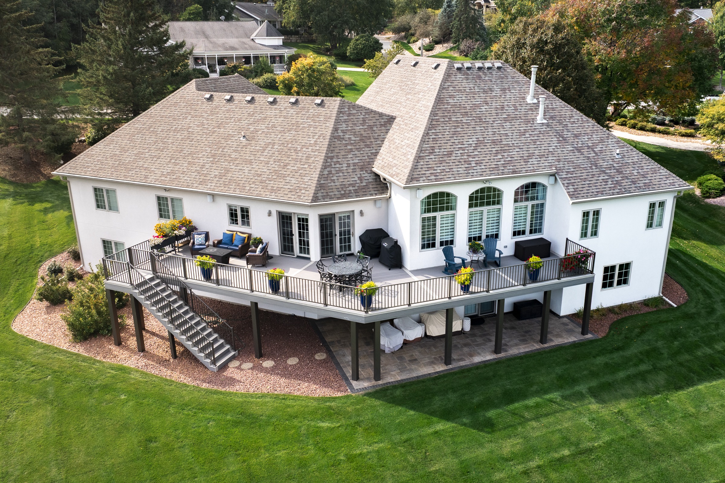 Large suburban home with elevated backyard deck