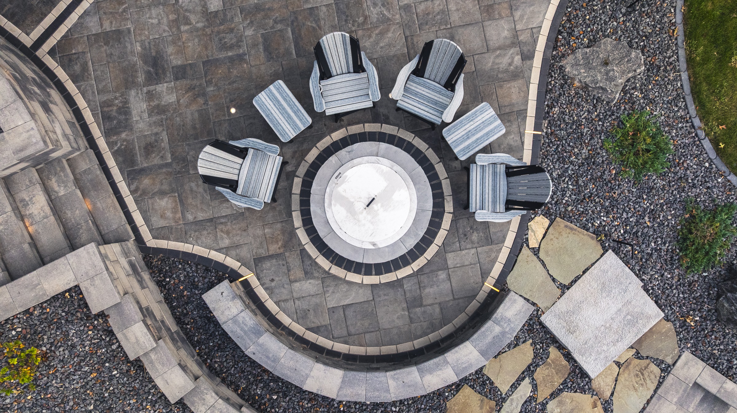 Aerial view of circular patio with fire pit