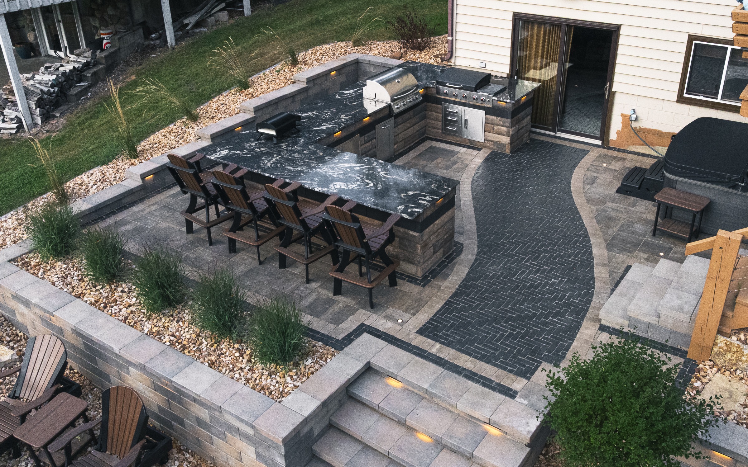 Modern backyard outdoor kitchen with bar seating
