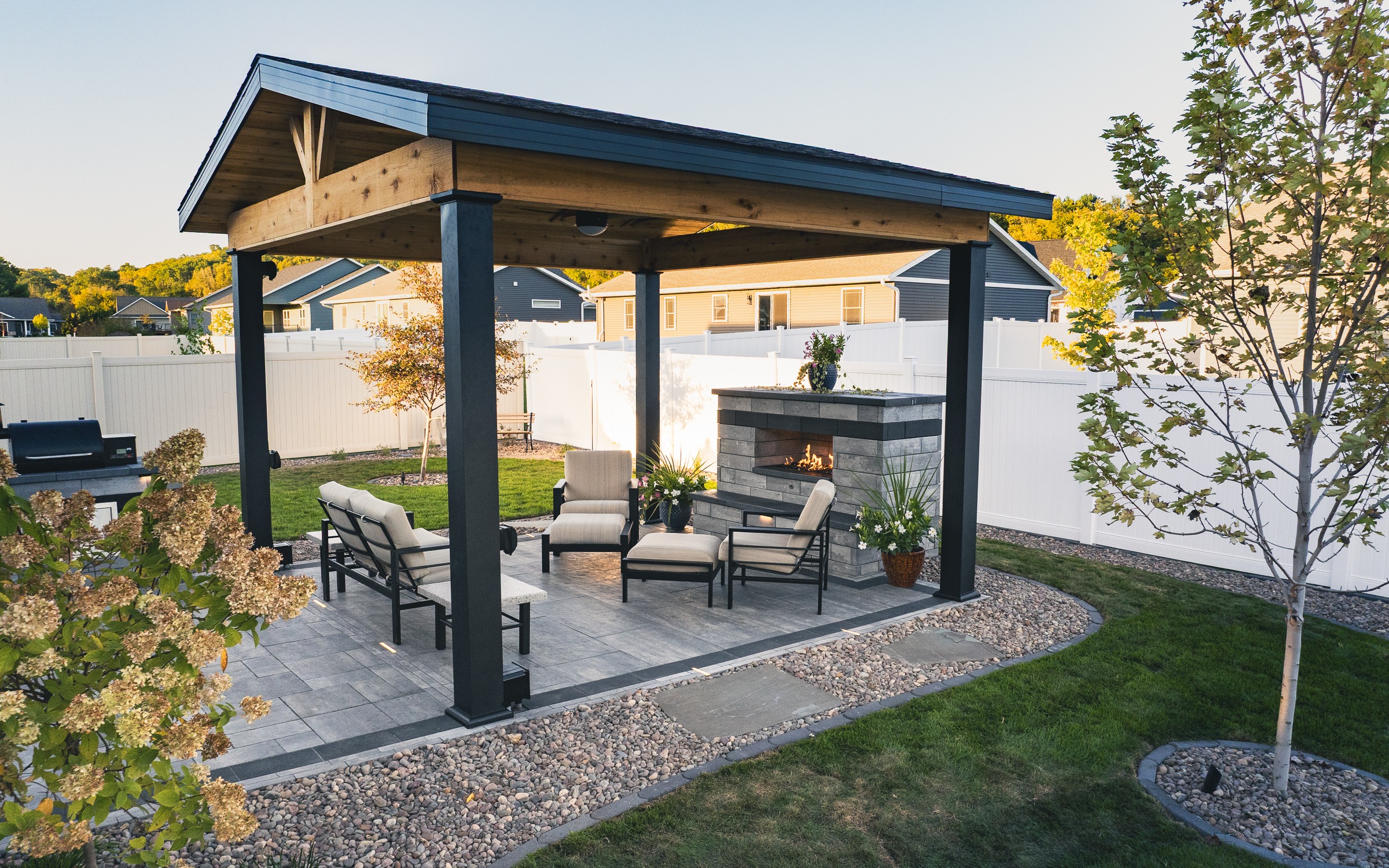 Backyard patio with pergola and outdoor fireplace