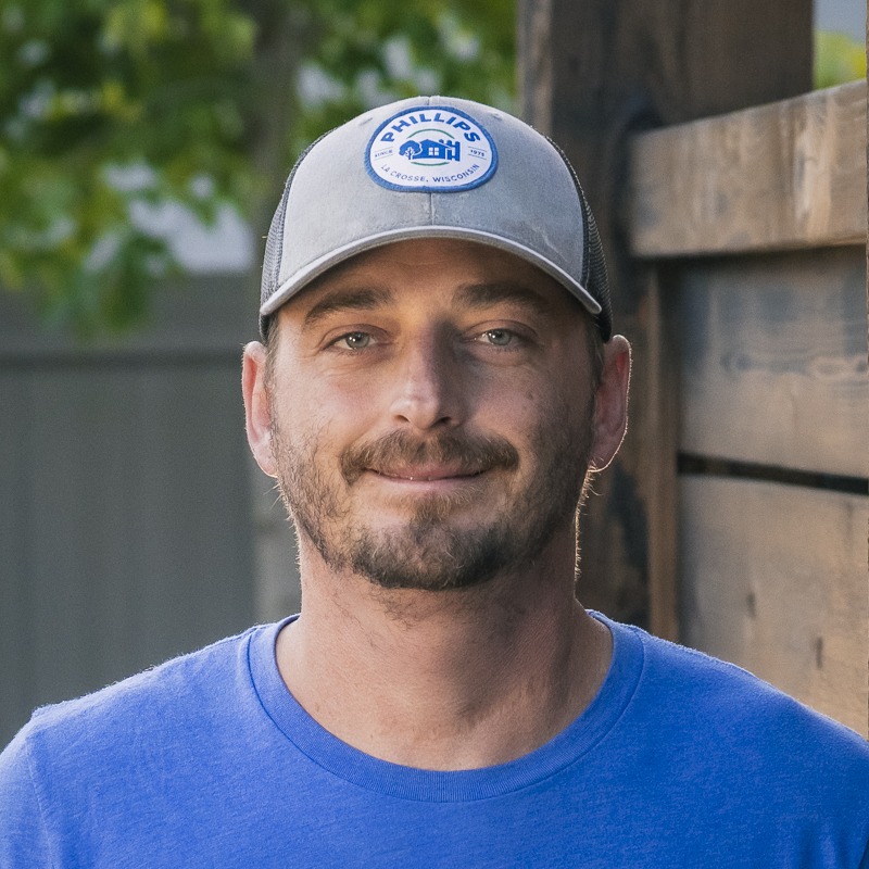 Man wearing gray cap and blue shirt outdoors