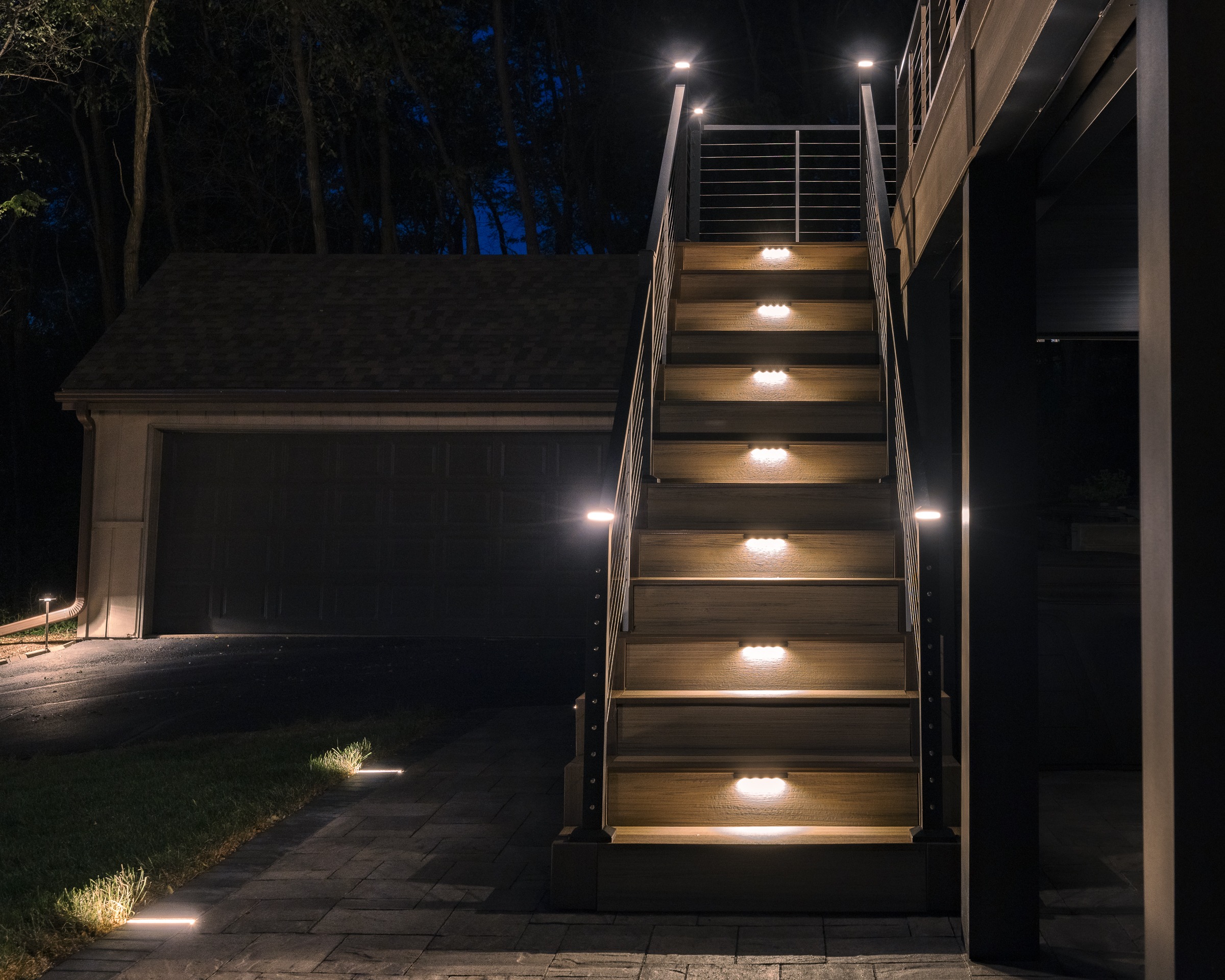 Outdoor staircase with LED step lights at night