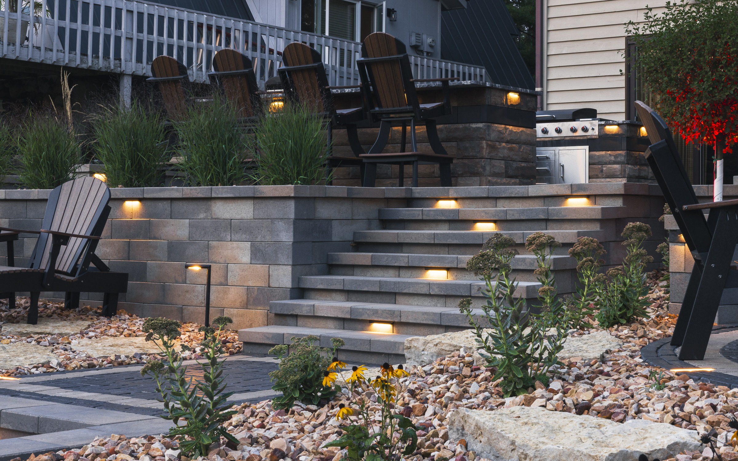 Modern backyard patio with illuminated stone steps