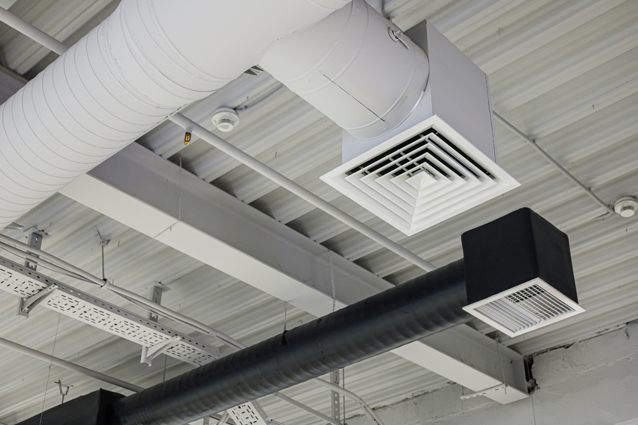 Industrial ceiling with HVAC ducts and air vents