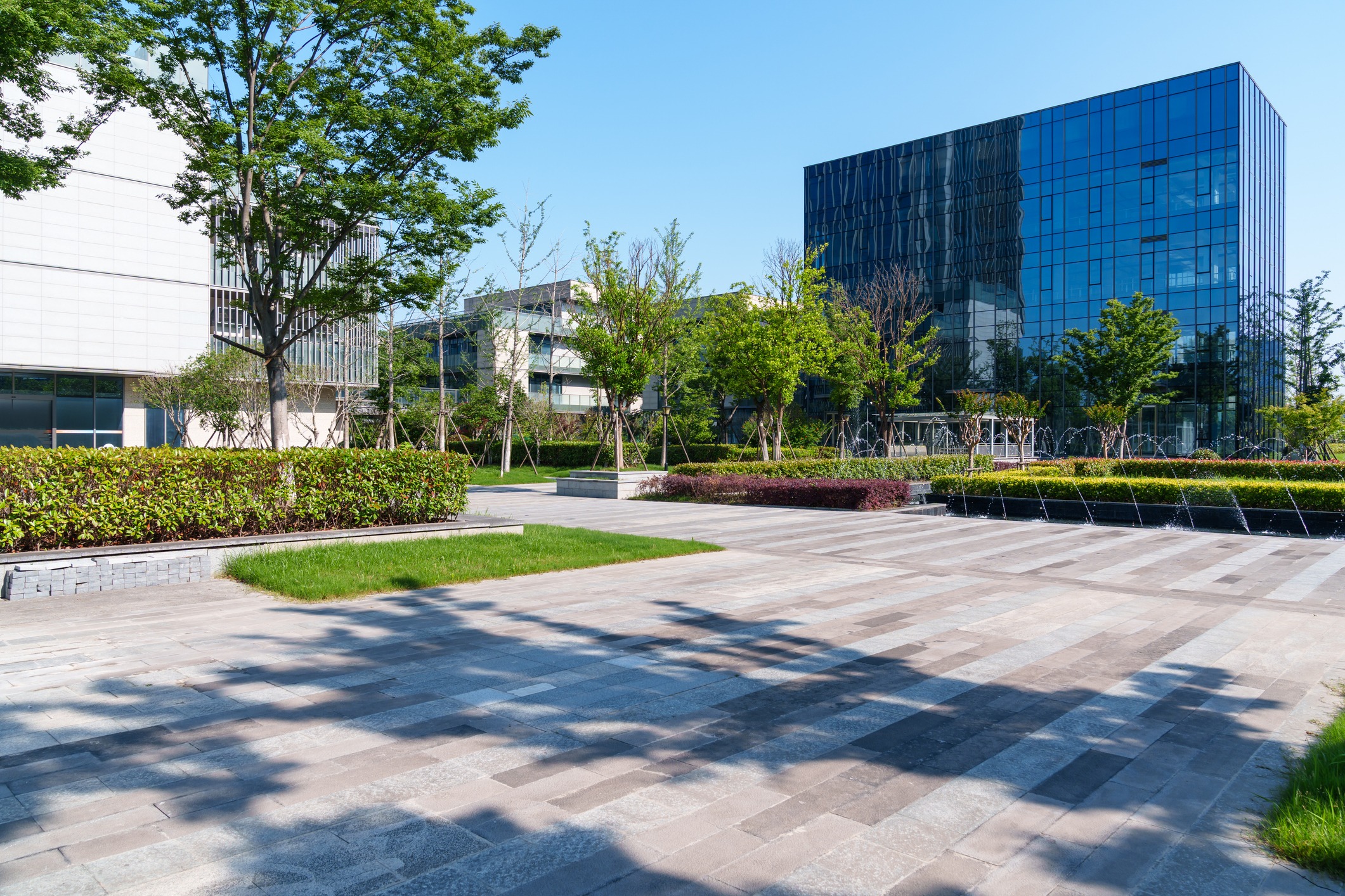 Modern office buildings with landscaped courtyard and fountain