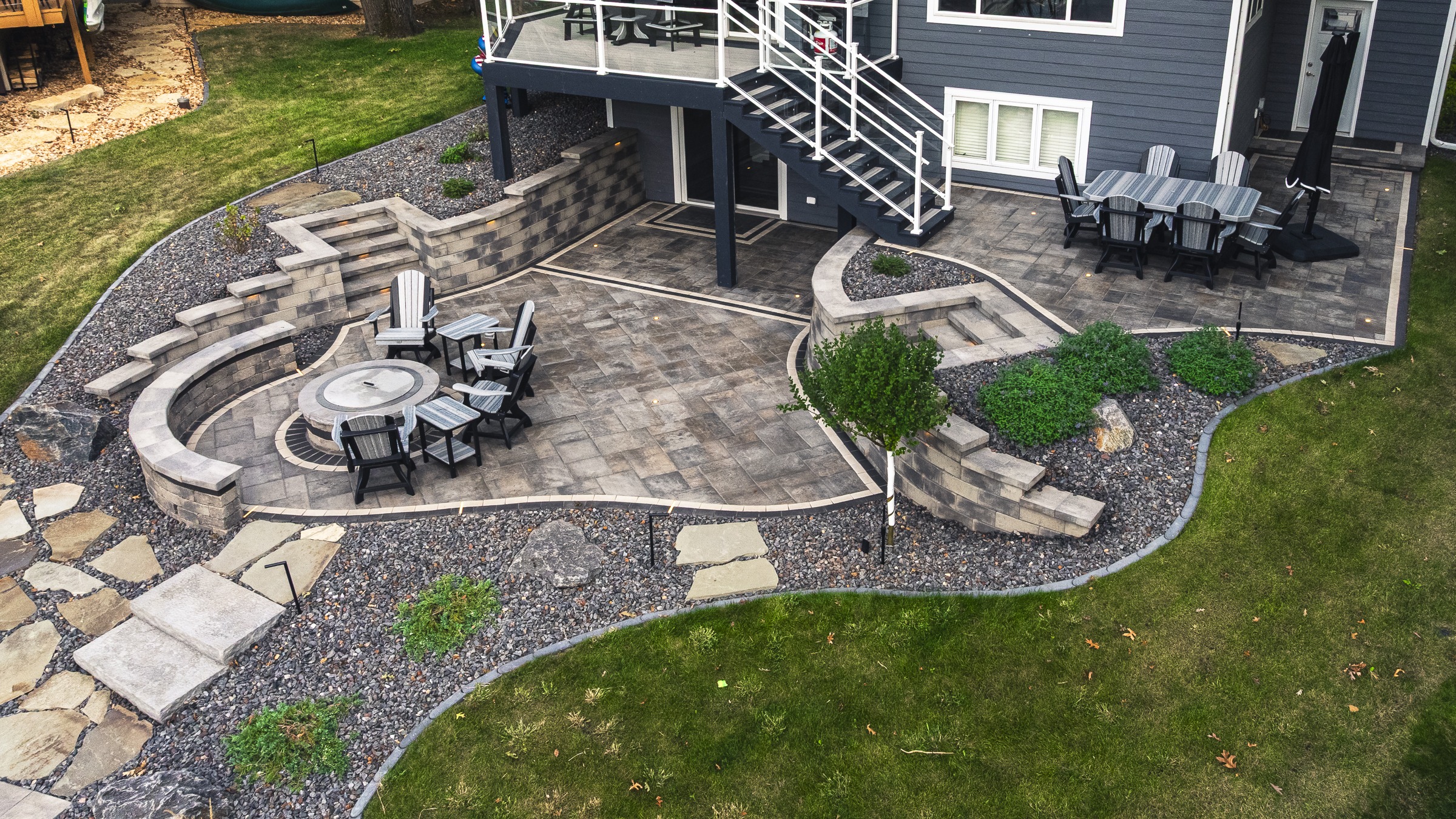 Backyard patio with fire pit and seating area