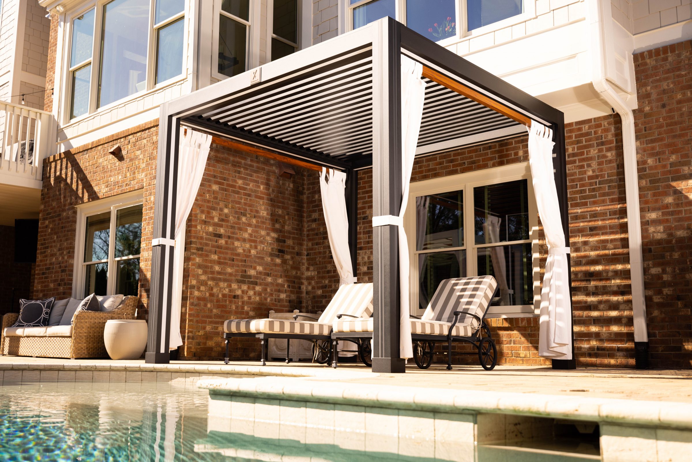Modern pergola with lounge chairs by pool