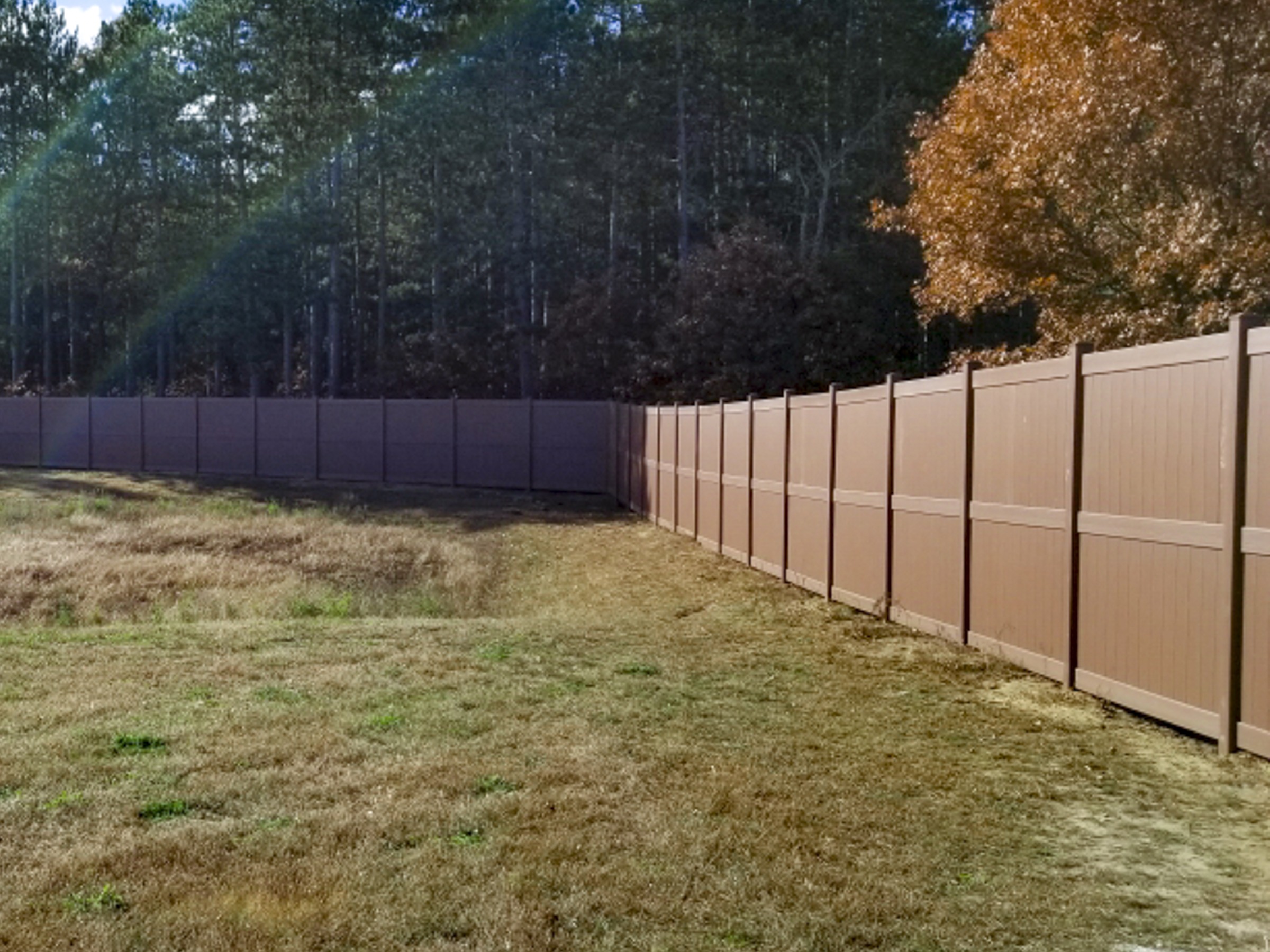 Commercial brown vinyl privacy fence project at Ho-Chunk Casino in Black River Falls, WI.