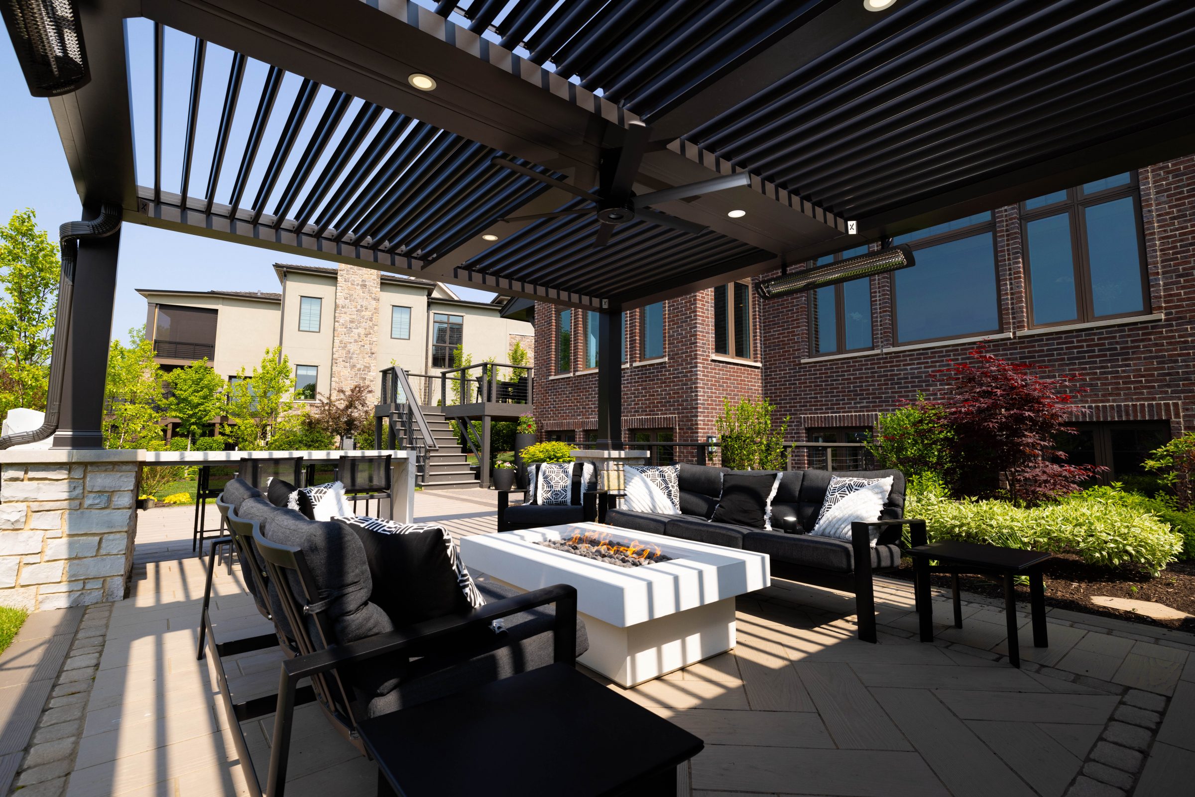 Modern backyard patio with pergola and fire pit