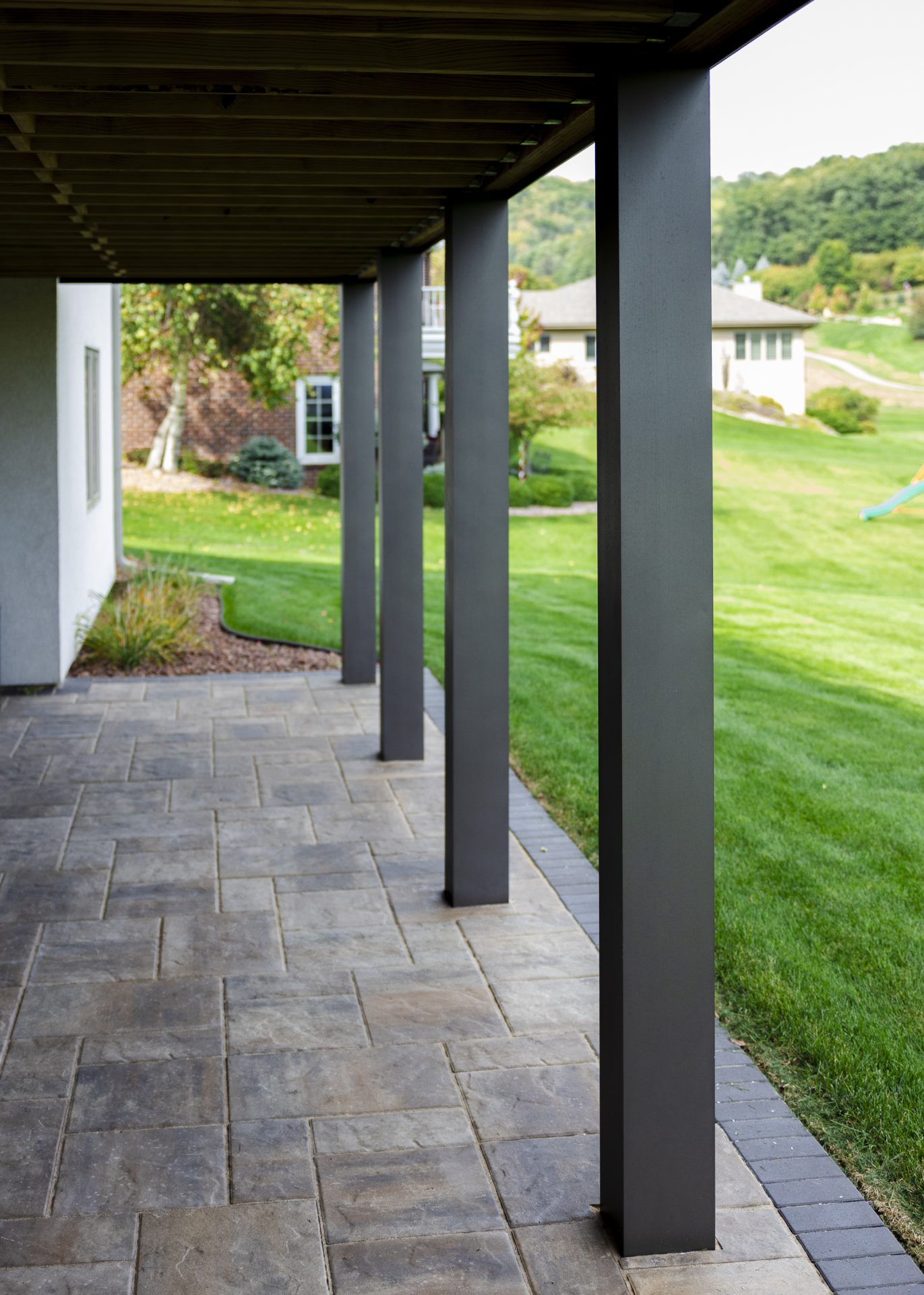 Aluminum post wraps protecting the supporting framework of a composite deck.