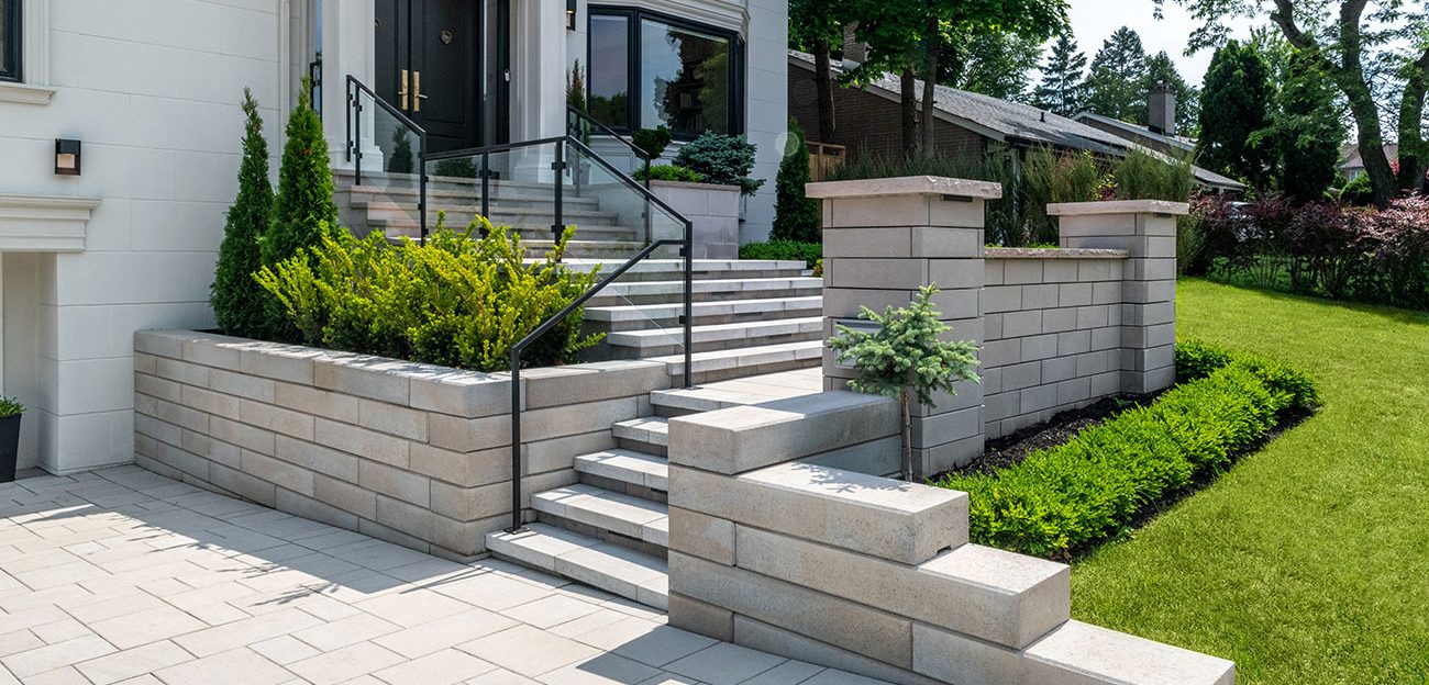 Modern home entrance with stone steps and landscaping